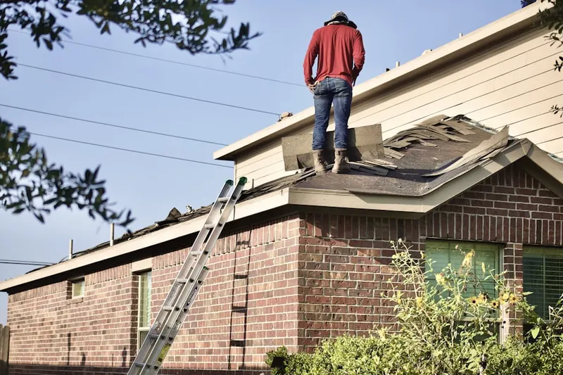 Professional roofer working on a residential roof in Lakeside Landing